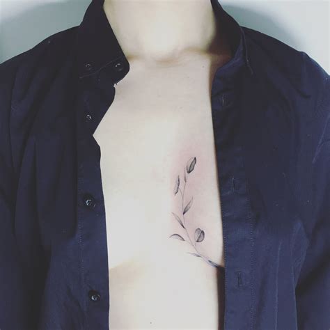 In between chest tattoo for women